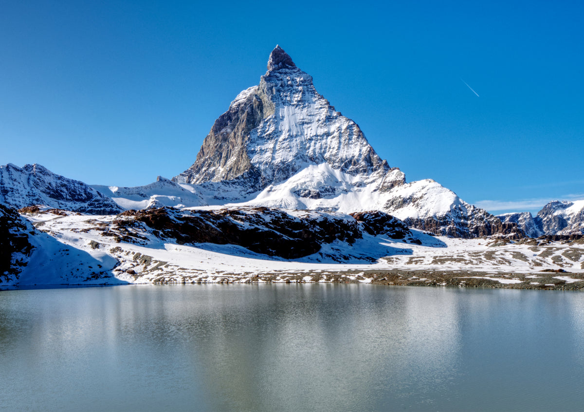 Fine Art Print des Matterhorns in der Schweiz mit See im Vordergrund und blauem Himmel